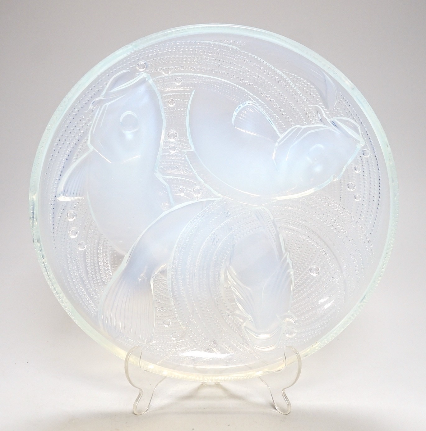Pierre D'Avesn - a Lalique style opalescent glass dish, moulded in relief with three carp among waves, 30cm diameter